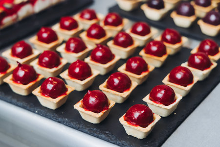 Catering table, beautifully decorated banquet with variety of different food snacks appetizers on Christmas birthday corporate party event or wedding celebration, canape, salad, delicatessen settingの写真素材