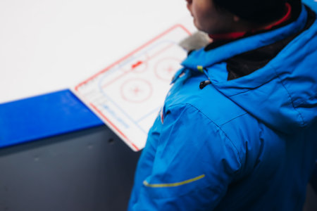 Hockey match game on ice rink arena stadium, team of ice hockey professional players with coach, stick and puck, team of hockey players in protective sport uniform training, hockey league championshipの写真素材