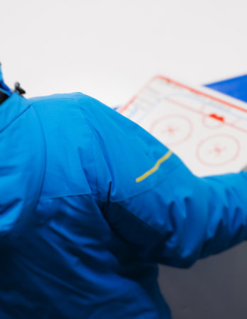 Hockey match game on ice rink arena stadium, team of ice hockey professional players with coach, stick and puck, team of hockey players in protective sport uniform training, hockey league championshipの写真素材