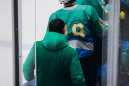 Hockey match game on ice rink arena stadium, team of ice hockey professional players with coach, stick and puck, team of hockey players in protective sport uniform training, hockey league championshipの写真素材