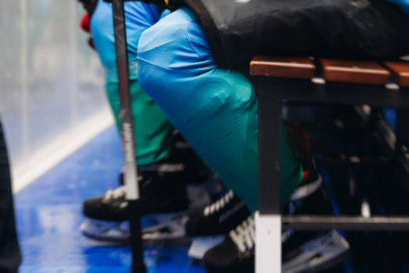 Hockey match game on ice rink arena stadium, team of ice hockey professional players with coach, stick and puck, team of hockey players in protective sport uniform training, hockey league championshipの写真素材