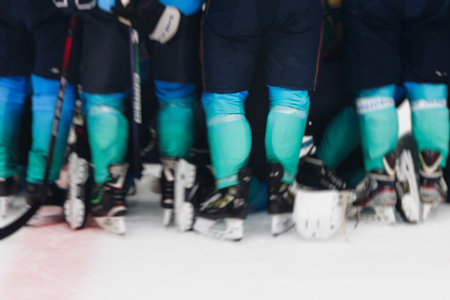 Hockey match game on ice rink arena stadium, team of ice hockey professional players with coach, stick and puck, team of hockey players in protective sport uniform training, hockey league championshipの写真素材