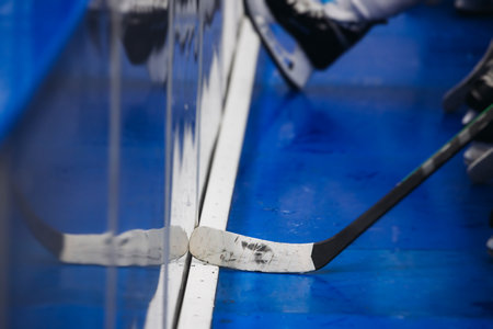 Hockey match game on ice rink arena stadium, team of ice hockey professional players with coach, stick and puck, team of hockey players in protective sport uniform training, hockey league championshipの写真素材