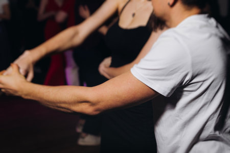 Couples dancing traditional latin argentinian dance milonga in a ballroom, tango salsa bachata...