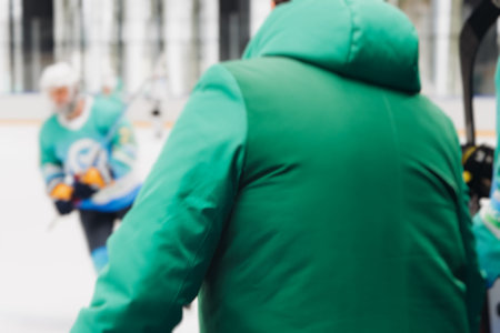 Hockey match game on ice rink arena stadium, team of ice hockey professional players with coach, stick and puck, team of hockey players in protective sport uniform training, hockey league championshipの写真素材