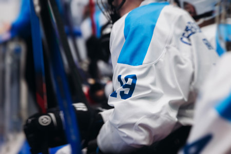 Hockey match game on ice rink arena stadium, team of ice hockey professional players with coach, stick and puck, team of hockey players in protective sport uniform training, hockey league championshipの写真素材