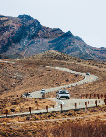 Mount Aso Nakadake volcano crater, Aso-San, caldera, Aso-Kuju National Park hiking, Kyushu island region, Kumamoto prefecture, Japan, eruption with steam and smoke, volcanic desert landscape viewの写真素材