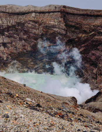 Mount Aso Nakadake volcano crater, Aso-San, caldera, Aso-Kuju National Park hiking, Kyushu island region, Kumamoto prefecture, Japan, eruption with steam and smoke, volcanic desert landscape viewの写真素材