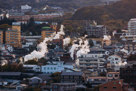 Beppu, Japan, city panorama skyline, Kannawa onsen distict, Oita prefecture, Kyushu island region,, Yukemuri observation deck, rising hot steam from onsen ryokan bath houses, Beppu resort hot springsの写真素材