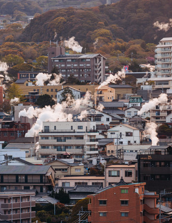 Beppu, Japan, city panorama skyline, Kannawa onsen distict, Oita prefecture, Kyushu island region,, Yukemuri observation deck, rising hot steam from onsen ryokan bath houses, Beppu resort hot springsの写真素材
