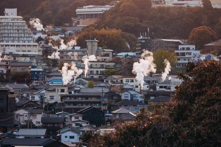 Beppu, Japan, city panorama skyline, Kannawa onsen distict, Oita prefecture, Kyushu island region,, Yukemuri observation deck, rising hot steam from onsen ryokan bath houses, Beppu resort hot springsの写真素材