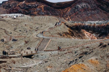 Mount Aso Nakadake volcano crater, Aso-San, caldera, Aso-Kuju National Park hiking, Kyushu island region, Kumamoto prefecture, Japan, eruption with steam and smoke, volcanic desert landscape viewの写真素材