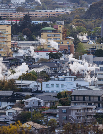 Beppu, Japan, city panorama skyline, Kannawa onsen distict, Oita prefecture, Kyushu island region,, Yukemuri observation deck, rising hot steam from onsen ryokan bath houses, Beppu resort hot springsの写真素材