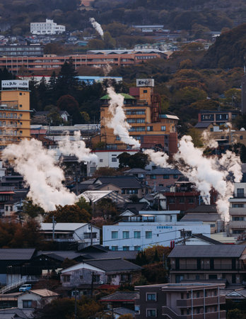 Beppu, Japan, city panorama skyline, Kannawa onsen distict, Oita prefecture, Kyushu island region,, Yukemuri observation deck, rising hot steam from onsen ryokan bath houses, Beppu resort hot springsの写真素材