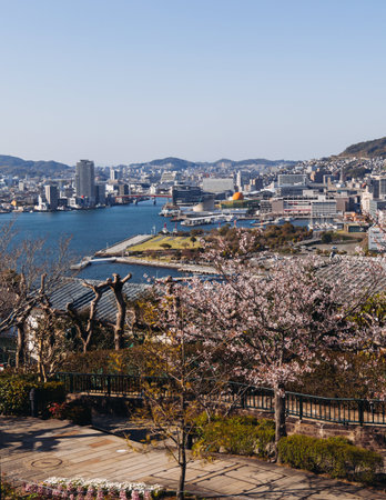 Glover Garden in Nagasaki, Japan, Minamiyamate hill, beautiful park view, with city skyline and cherry sakura blossom, in a spring sunny day with a blue sky, Nagasaki prefecture, Kyushu island regionの写真素材
