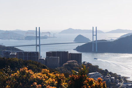 Nagasaki panorama, Japan, beautiful aerial view, with city skyline, port and mountains, seen from...