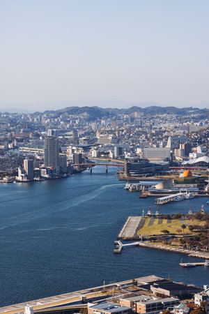 Nagasaki panorama, Japan, beautiful aerial view, with city skyline, port and mountains, seen from Nabekammuri mount, in a spring sunny day with a blue sky, Nagasaki prefecture, Kyushu island regionの写真素材