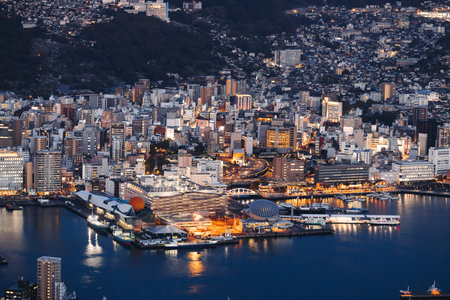Nagasaki night panorama, aerial view, city skyline, port and mountains, seen from Inasa mount, Inasayama park, city illumination, Nagasaki prefecture, Kyushu island region, ropeway cable carの写真素材