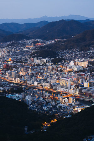Nagasaki night panorama, Japan, aerial view, city skyline, port and mountains, seen from Inasa...