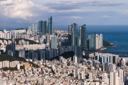Busan city panorama beautiful skyline view from Hwangnyeongsan mountain observatory, Busan port, Gwangan bridge and harbor bay, South Korea, Yeongnam district, sunny day, travel to Republic of Koreaの写真素材