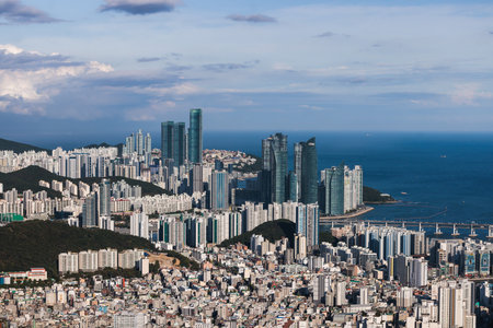 Busan city panorama beautiful skyline view from Hwangnyeongsan mountain observatory, Busan port, Gwangan bridge and harbor bay, South Korea, Yeongnam district, sunny day, travel to Republic of Koreaの写真素材