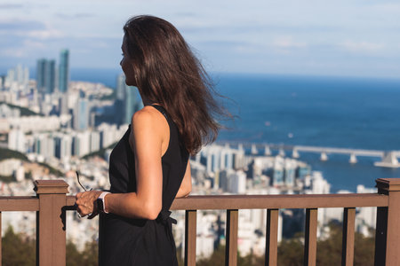 Busan city panorama beautiful skyline view from Hwangnyeongsan mountain observatory, Busan port, Gwangan bridge and harbor bay, South Korea, Yeongnam district, sunny day, travel to Republic of Koreaの写真素材