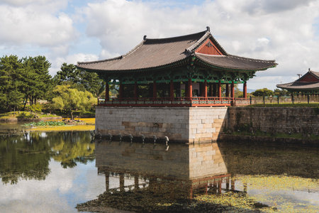 Gyeongju, South Korea, view of Donggung Palace and Wolji Pond in a sunny day, North Gyeongsang Province, Gyeongju city, Silla dinasty traditional Korean hanok architecture, Yeongnam regionの写真素材