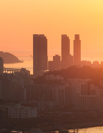 Busan sunset city panorama, beautiful skyline view with high-rise buildings skyscrapers at dawn, Busan port daybreak, cityscape with harbor bay, South Korea, Yeongnam district, sunny dayの写真素材