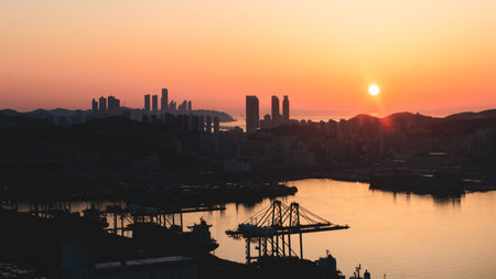 Busan sunset city panorama, beautiful skyline view with high-rise buildings skyscrapers at dawn, Busan port daybreak, cityscape with harbor bay, South Korea, Yeongnam district, sunny dayの写真素材