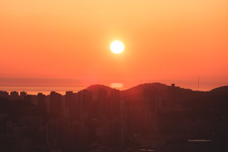 Busan sunset city panorama, beautiful skyline view with high-rise buildings skyscrapers at dawn, Busan port daybreak, cityscape with harbor bay, South Korea, Yeongnam districtの写真素材