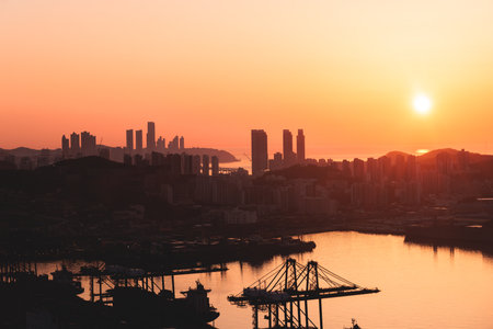 Busan sunset city panorama, beautiful skyline view with high-rise buildings skyscrapers at dawn, Busan port daybreak, cityscape with harbor bay, South Korea, Yeongnam district, sunny dayの写真素材