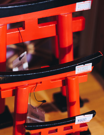 Traditional Japanese tourist souvenirs and gifts from Tokyo, Japan, with mount Fuji figures, refrigerator magnets, Maneki-neko beckoning cat figurine, key ring keychain, in a local vendor gift shopの写真素材