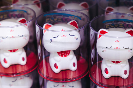Traditional Japanese tourist souvenirs and gifts from Tokyo, Japan, with mount Fuji figures, refrigerator magnets, Maneki-neko beckoning cat figurine, key ring keychain, in a local vendor gift shopの写真素材