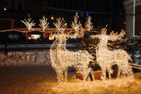 New Year and Christmas in Russia, glowing decor decoration in a winter snowy street, with night decor illumination, city outdoor decorations, Saint-Petersburg, christmas tree and garland lightの写真素材