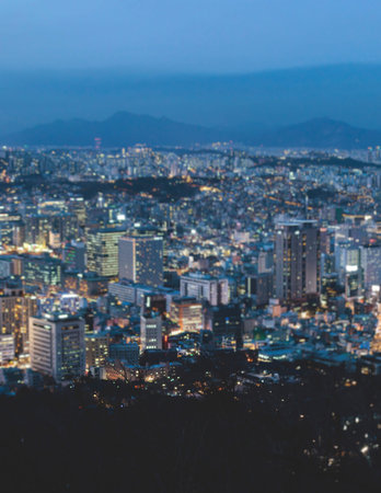Seoul night skyline, South Korea, beautiful aerial twilight view, with mountains and scenery beyond...