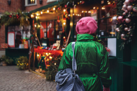 Christmas market with illuminated food stalls, gift shops and kiosks, New Year outdoor fair decorations, garlands and festoons, Xmas atmosphere, retail and store illumination, decor in Europe city