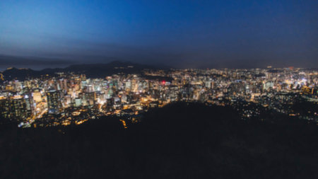 Seoul night skyline, South Korea, beautiful aerial twilight view, with mountains and scenery beyond the city, seen from observation deck of Namsan Park, Gyeonggi-do province, Republic of Koreaの写真素材