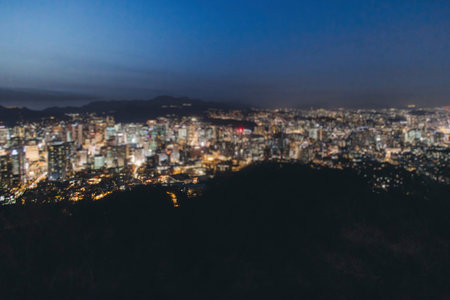Seoul night skyline, South Korea, beautiful aerial twilight view, with mountains and scenery beyond...