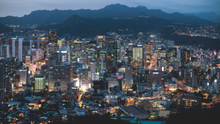 Seoul night skyline, South Korea, beautiful aerial twilight view, with mountains and scenery beyond...