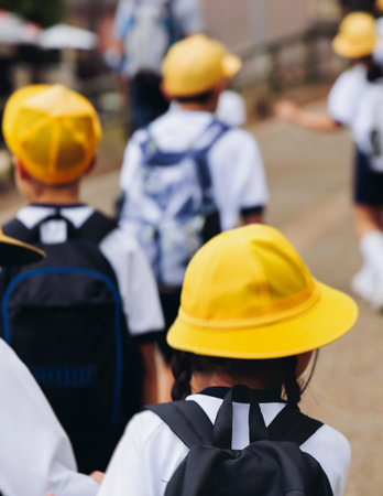 Group of school children students outdoor excursion, guided tour in the city with guide, docent with...