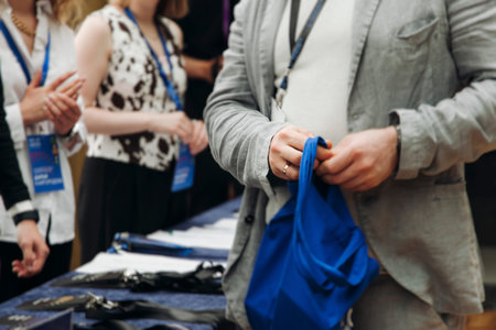 Process of checking in on conference congress forum event, registration desk table, visitors and...