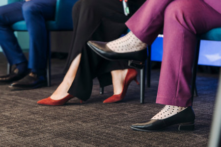 Speakers shoes legs at the business conference event, audience on forum summit, plenary session...
