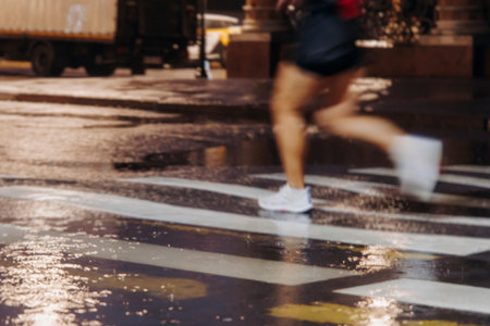 Night runners in the rain, sportsmen participants start running the half-marathon in the city...