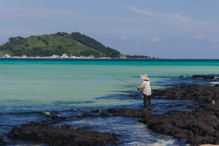 Jeju Island, white sand beach and sea, landscape view in a sunny day, and Biyangdo island