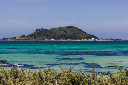 Jeju Island, white sand beach and sea, landscape view in a sunny day, and Biyangdo island