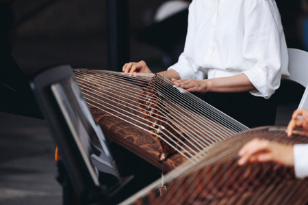 Traditional Korean folk musical instrument Gayageum, female orchestra band performing concert on...