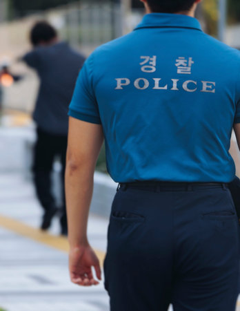 Korean Police squad formation in protective uniform with Police logo, policemen officer patrol...