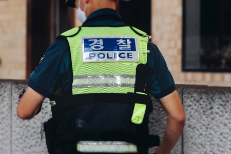 Police squad formation in protective uniform, policemen officer patrol maintain public during...