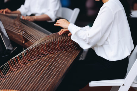 Traditional Korean folk musical instrument Gayageum, female orchestra band performing concert on...