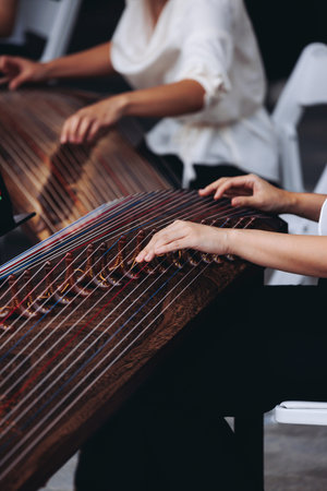 Traditional Korean folk musical instrument Gayageum, female orchestra band performing concert on...